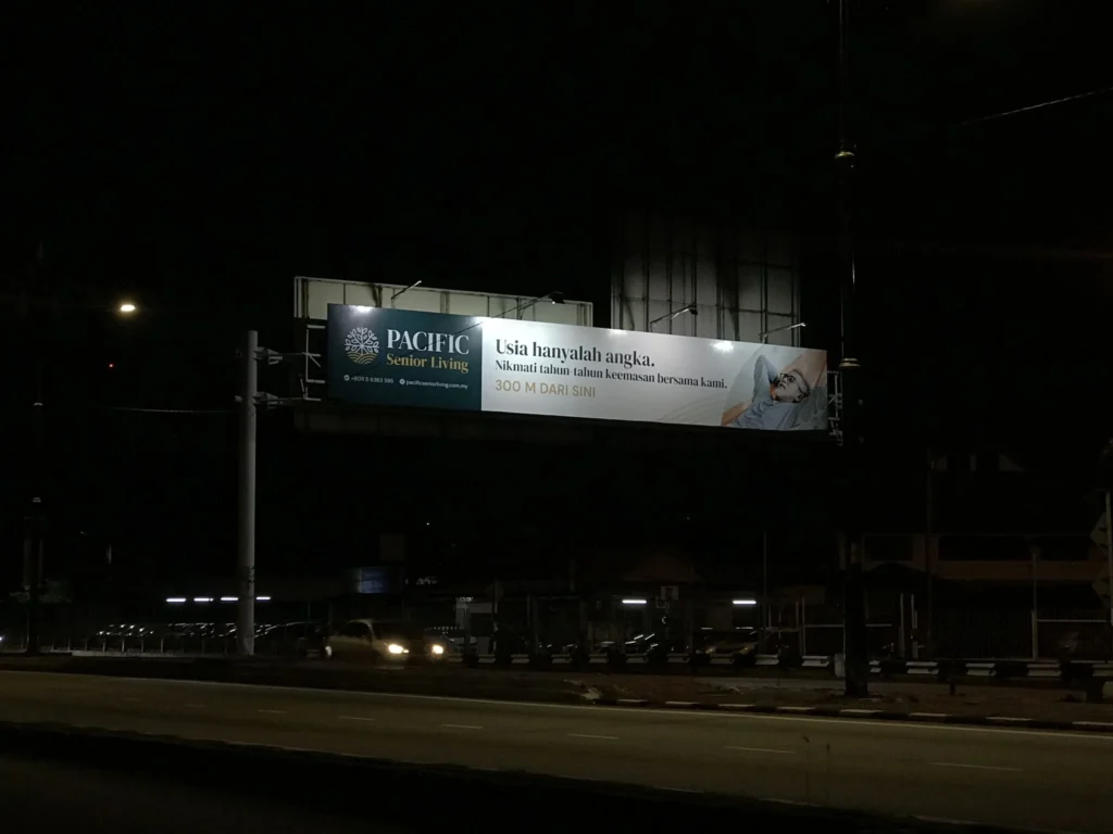 Pacific Senior Living billboard at night